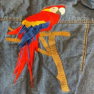 Denim jacket with embroidered parrot